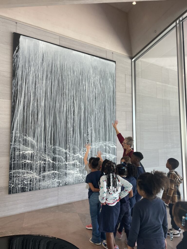 students looking at art